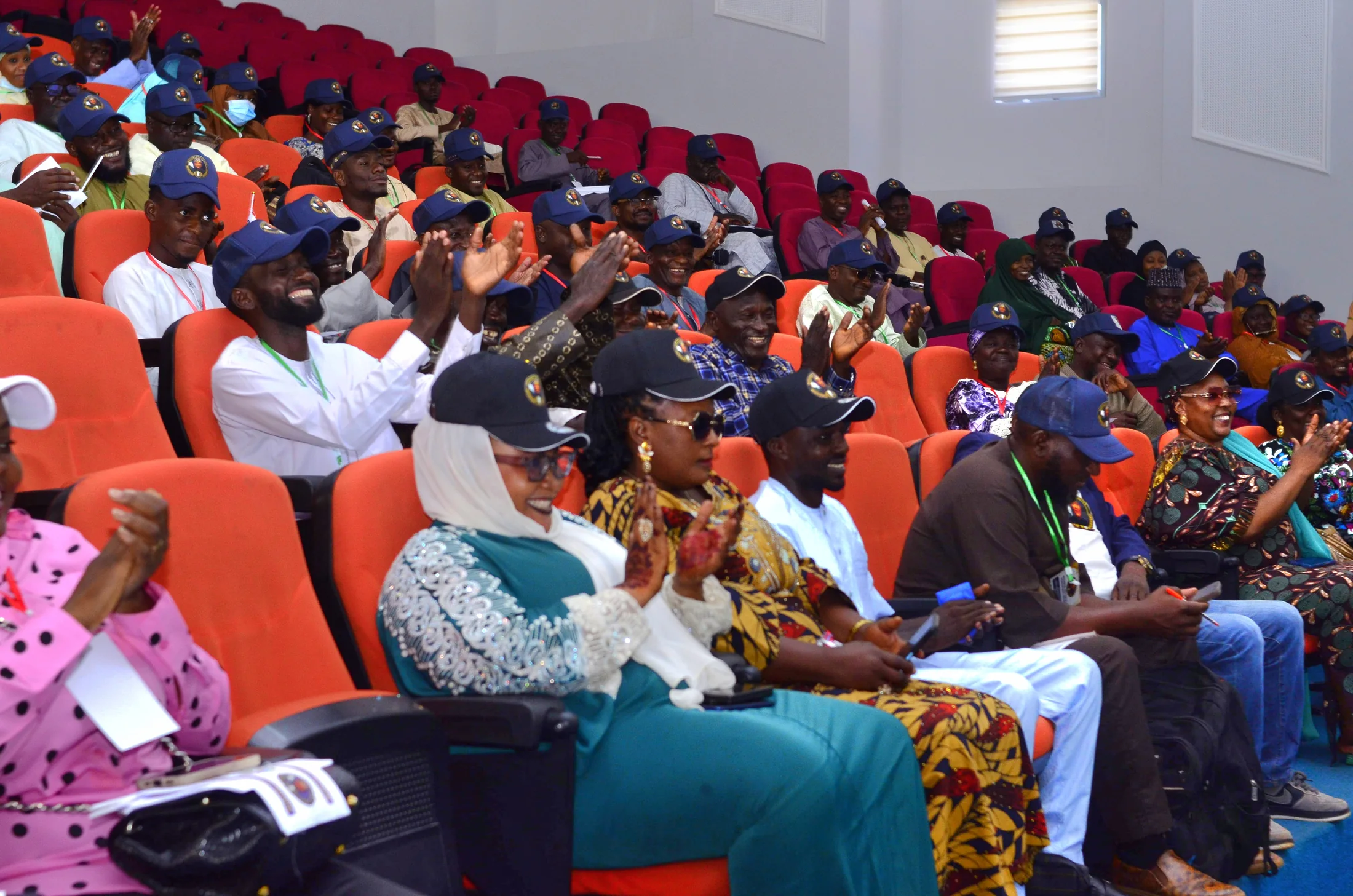 A professional cohort applauding during a learning session