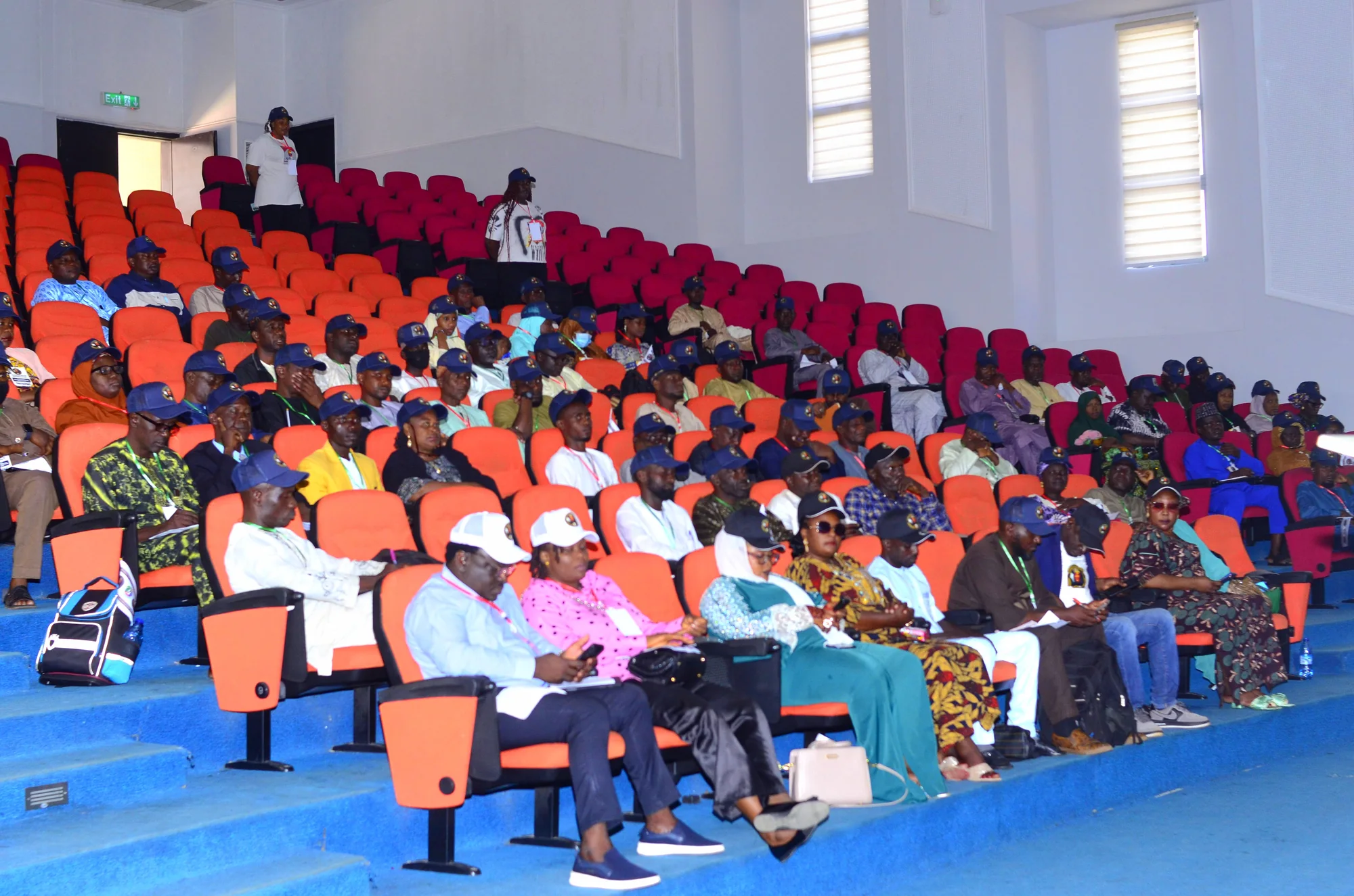 A large cohort seated in an auditorium at Ahmadu Bello University, Zaria, during a professional learning session